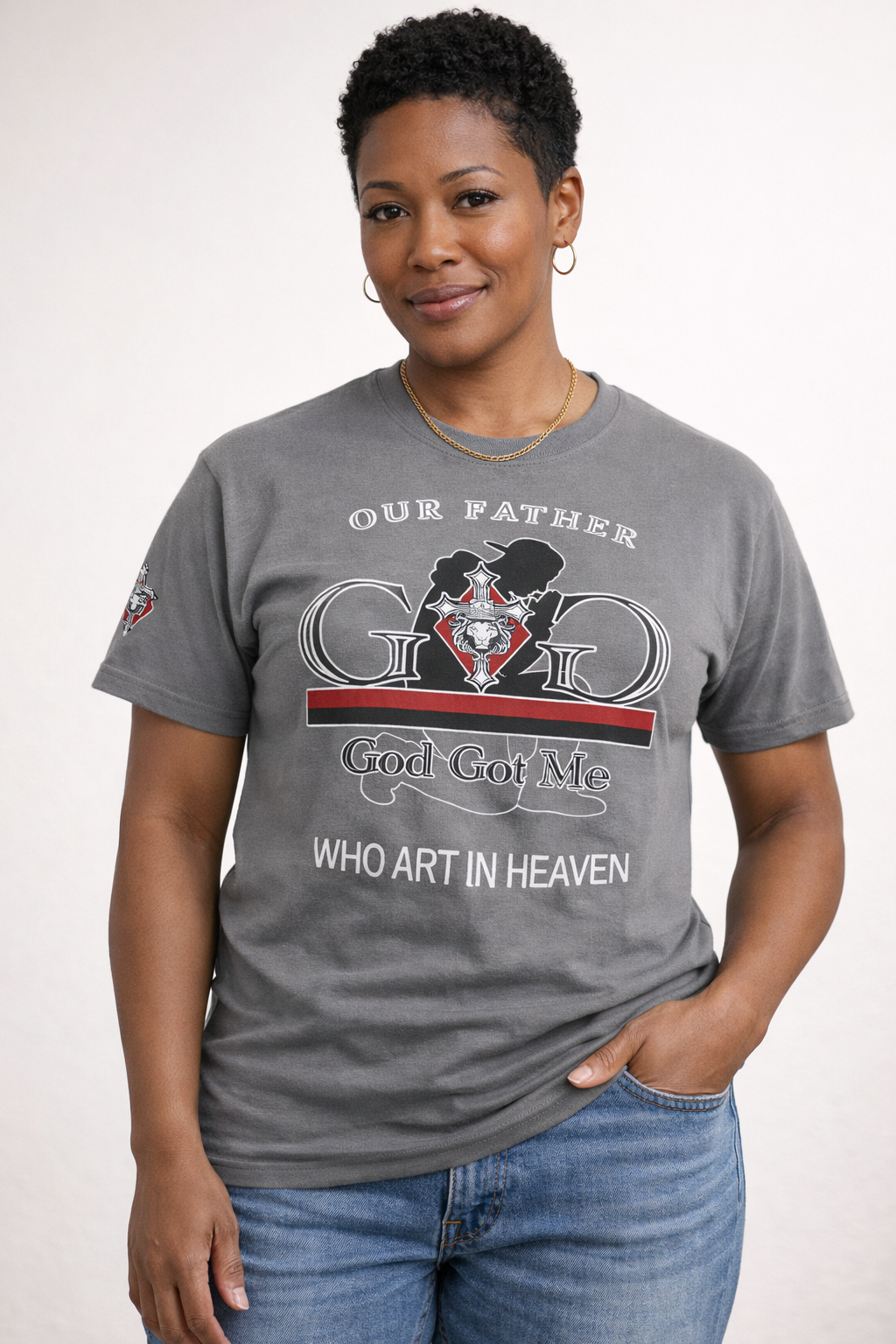 Person wearing a gray t-shirt with a graphic design and text.