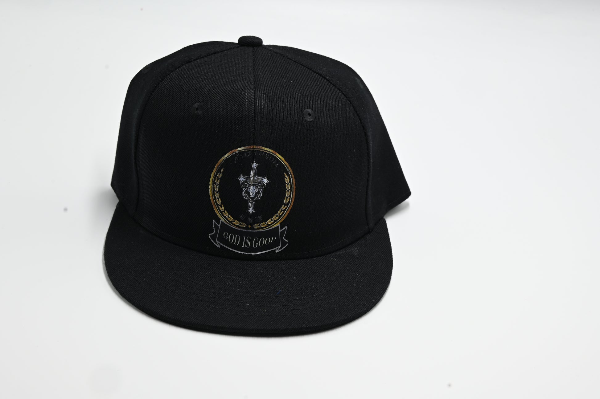 Black cap with a logo and text on a white background