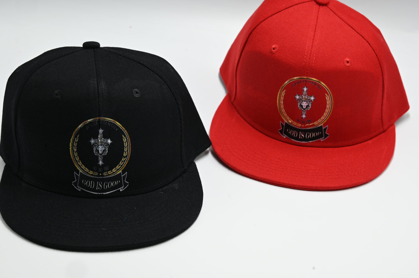 Black and red caps with a central emblem on a white background