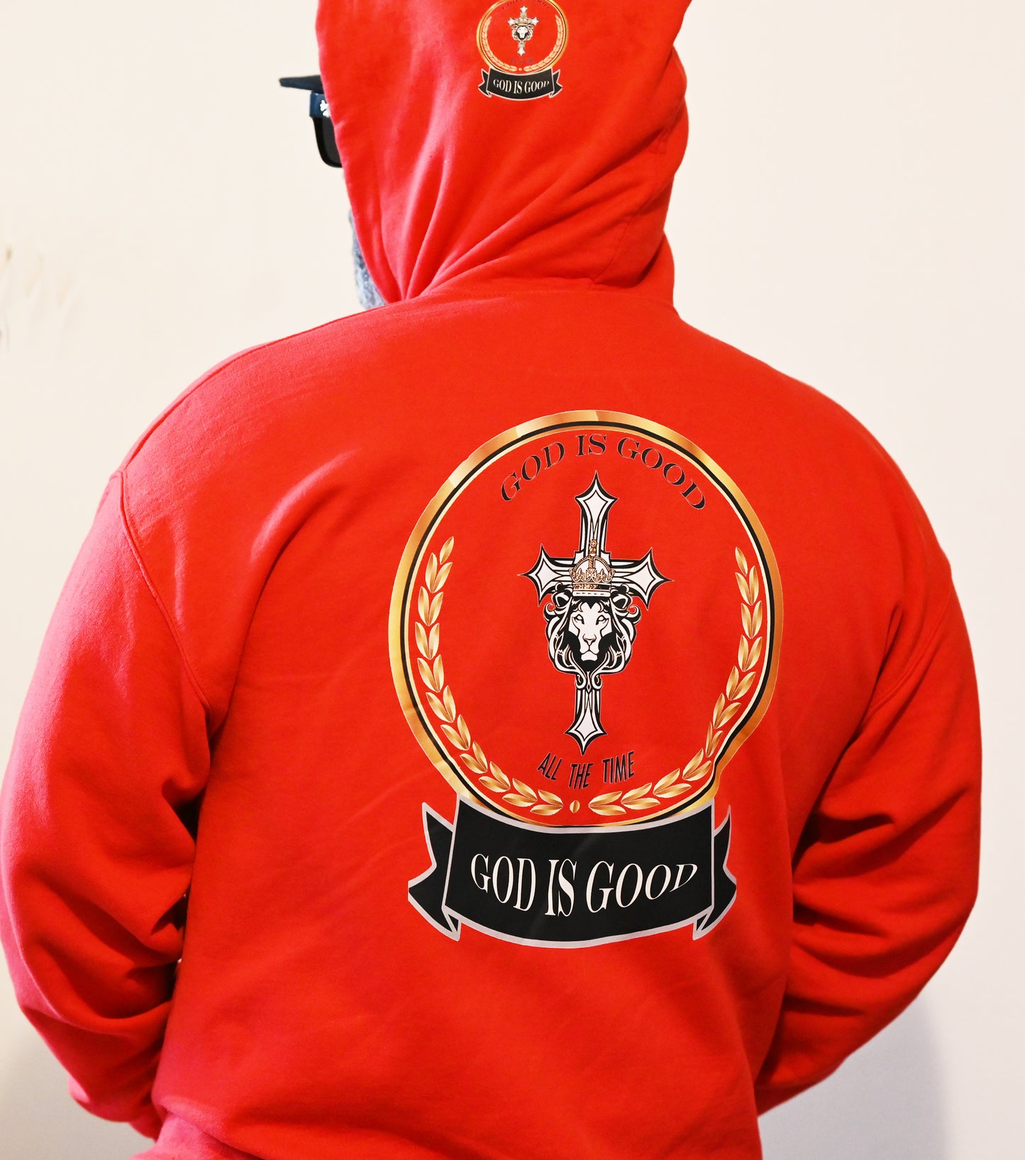 Red hoodie with 'God is Good' logo on the back against a plain background