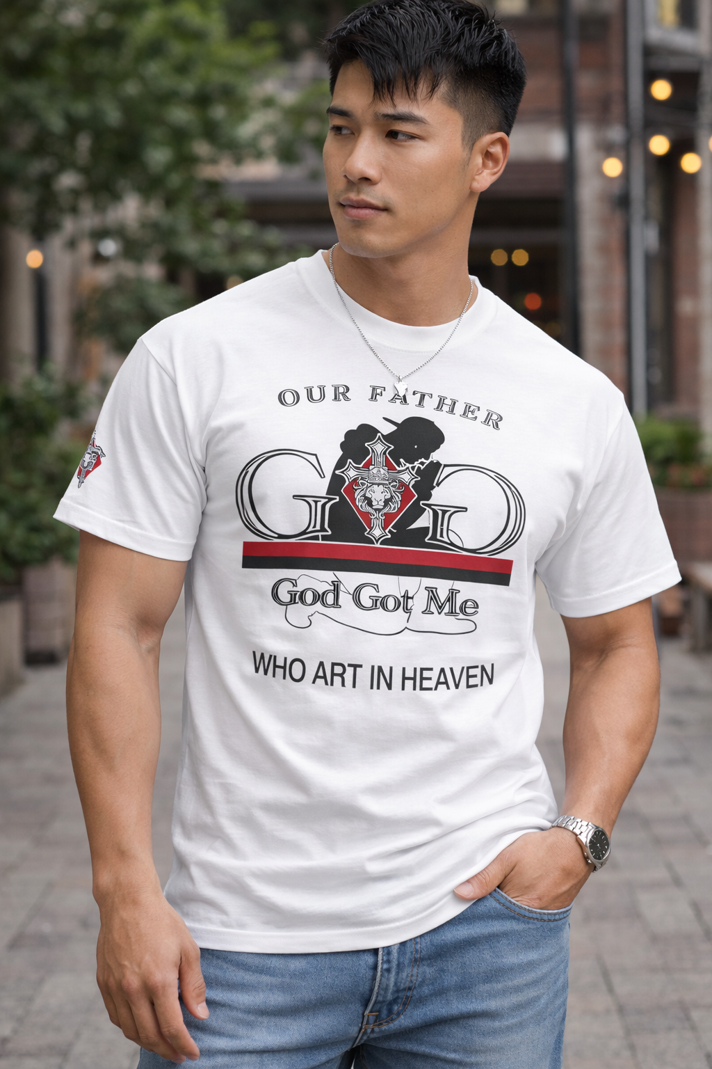 Man wearing a white t-shirt with a graphic design and text outdoors.