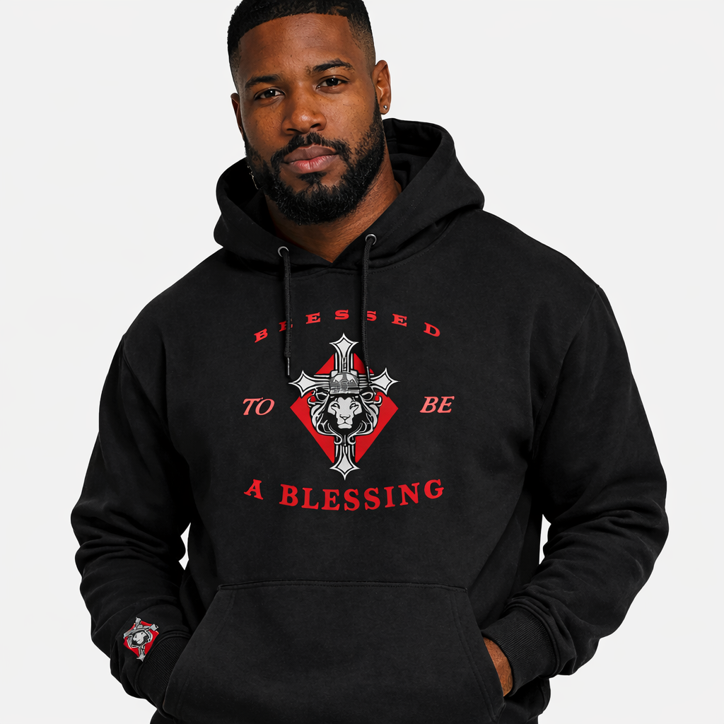 Man wearing a black hoodie with red and white text and design on a plain background